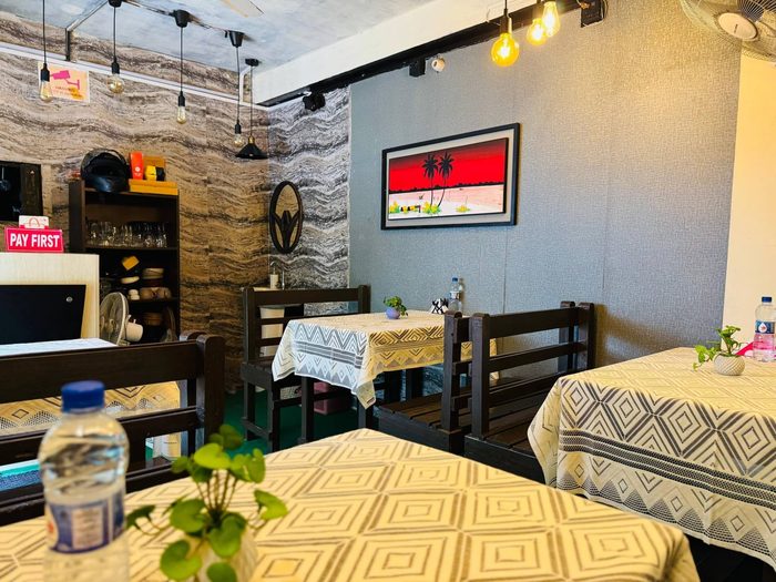 Cozy indoor table seating at The Pahalgam